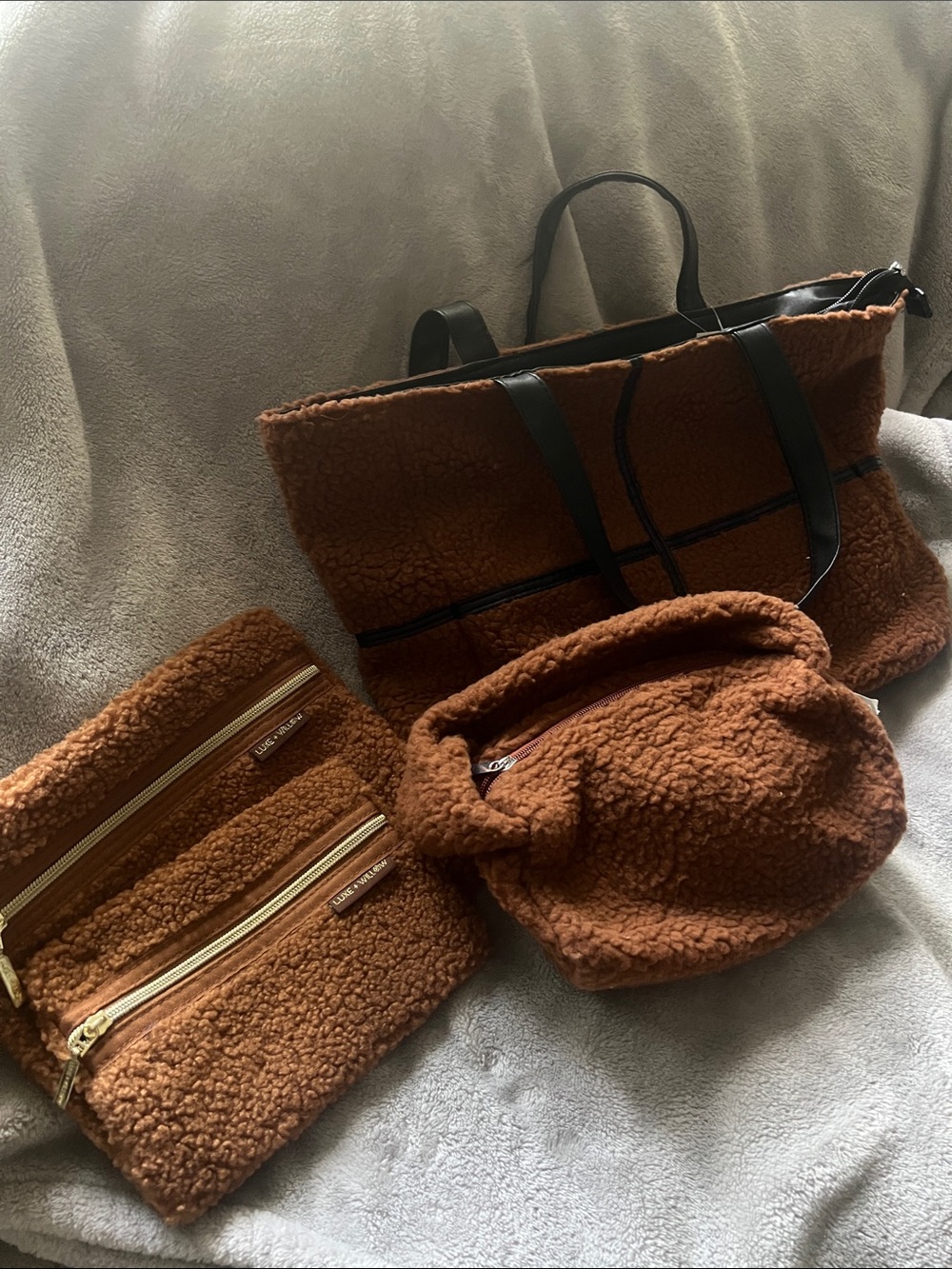 Brown Sherpa Tote and Pouch Set plus 2 flat cosmetic bags.